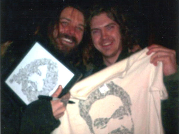 Simon Neil and his drawinside picture with doodles